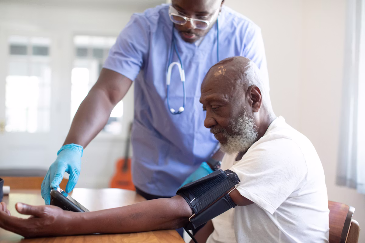 A healthcare professional checking a patient's blood pressure.